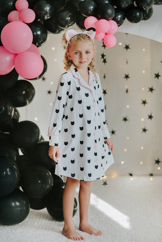 girls_black_cat_nightgown
halloween_pajamas_for_kids
cat_print_sleepwear_girls
girls_button_up_pajama_dress
cute_kids_nightgown_cat_theme
fall_pajamas_for_girls
girls_sleepover_party_outfit