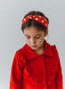 Our Miss Mouse Headband is red satin with white embroidered polka dots. There is a knot at the center. This hair accessory is versatile and can be styled many way. The hair accessory is comfortable and designed for all day wear.