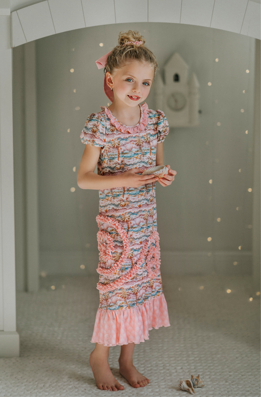 Girls Mermaid Princess nightgown. Pink ruffles with swirl pattern. Buttery soft fabric. Mermaid themed pattern. Perfect for a disney princess party.