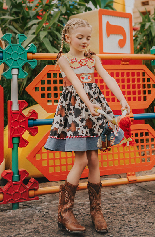 Child in a colorful playground with cartoon character decorations