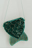 Green sequin mermaid tail purse with beaded fin and chain strap, hanging on white wall hook for whimsical girls dress-up or costume accessory
Mermaid tail-shaped beaded purse with shiny green sequins and zipper closure, perfect for girls pretend play or ocean-themed gifts