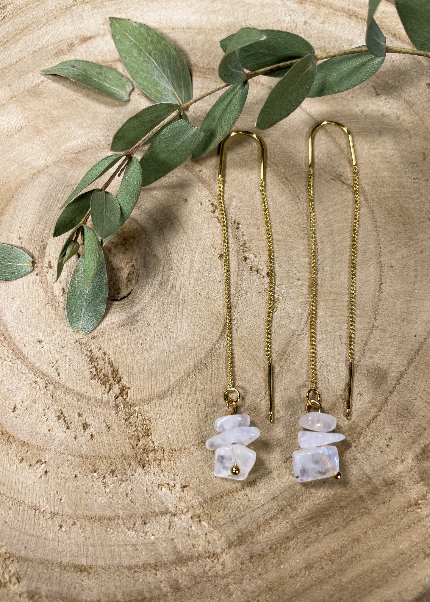 Golden Threader Earrings with 3 polished moonstone gems that dangle from the bottom.
