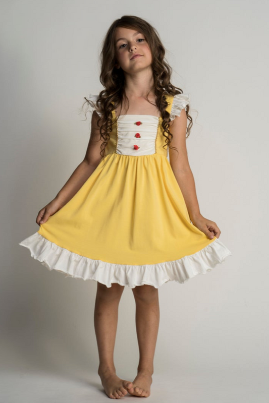 A young girl is wearing our Original Red Rose Twirl Dress from the Princess Twirl Collection. The sleeveless yellow dress features white ruffled trim and three red roses down the front. The sunny yellow dress provides a perfect princess twirl and soft comfortable cotton fabric.