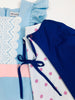 The Bo Peep Romper and royal blue Cape (removable). A light blue romper adorned with white lace trim, and leggings with ruffled ends. The flutter sleeves are eyelet lace.