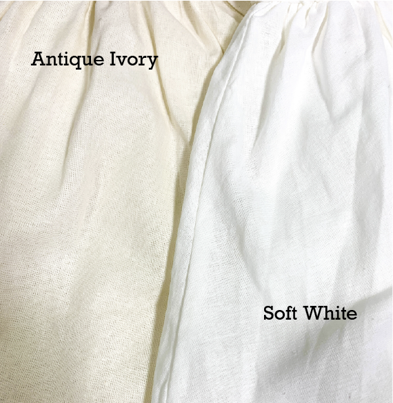 A close up of the fabric color options. On the left Antique Ivory. On the right, soft white.
