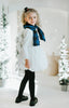 Little girl dressed in winter snowman-inspired Christmas outfit with long sleeves, plaid scarf, and puffy dress skirt for festive events and seasonal family portraits.

Cute girls holiday dress styled as a snowman costume with blue plaid scarf and white bubble hem, worn with black tights and shoes for a Christmas or winter theme look.