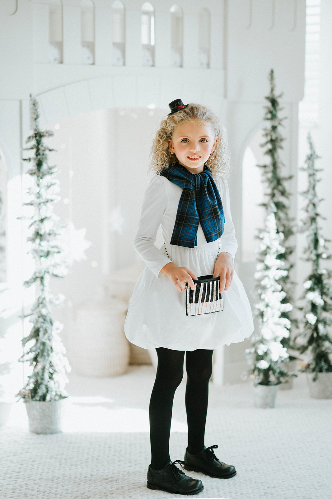 Music-themed clutch purse with piano key beadwork and pearl handle, perfect for gifts for pianists, teachers, or musicians attending concerts or parties.

Beaded piano clutch with pearl strap laid on keyboard, designed for performers, cocktail events, music teachers, or black-tie holiday occasions.

Statement beaded clutch with piano design and elegant pearl strap, styled for symphony night, jazz concert, or as a unique musician gift bag.