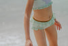 Child in seafoam green two-piece swimsuit with frilly straps and shell detail, posing on sandy beach in sunshine

Girls pastel mermaid swimsuit with purple shell top and ruffled bottoms, styled with gold accents and seashell sunglasses

Toddler to tween girl in ruffled shell-themed mermaid swimsuit with sparkle waistband, perfect for summer vacation