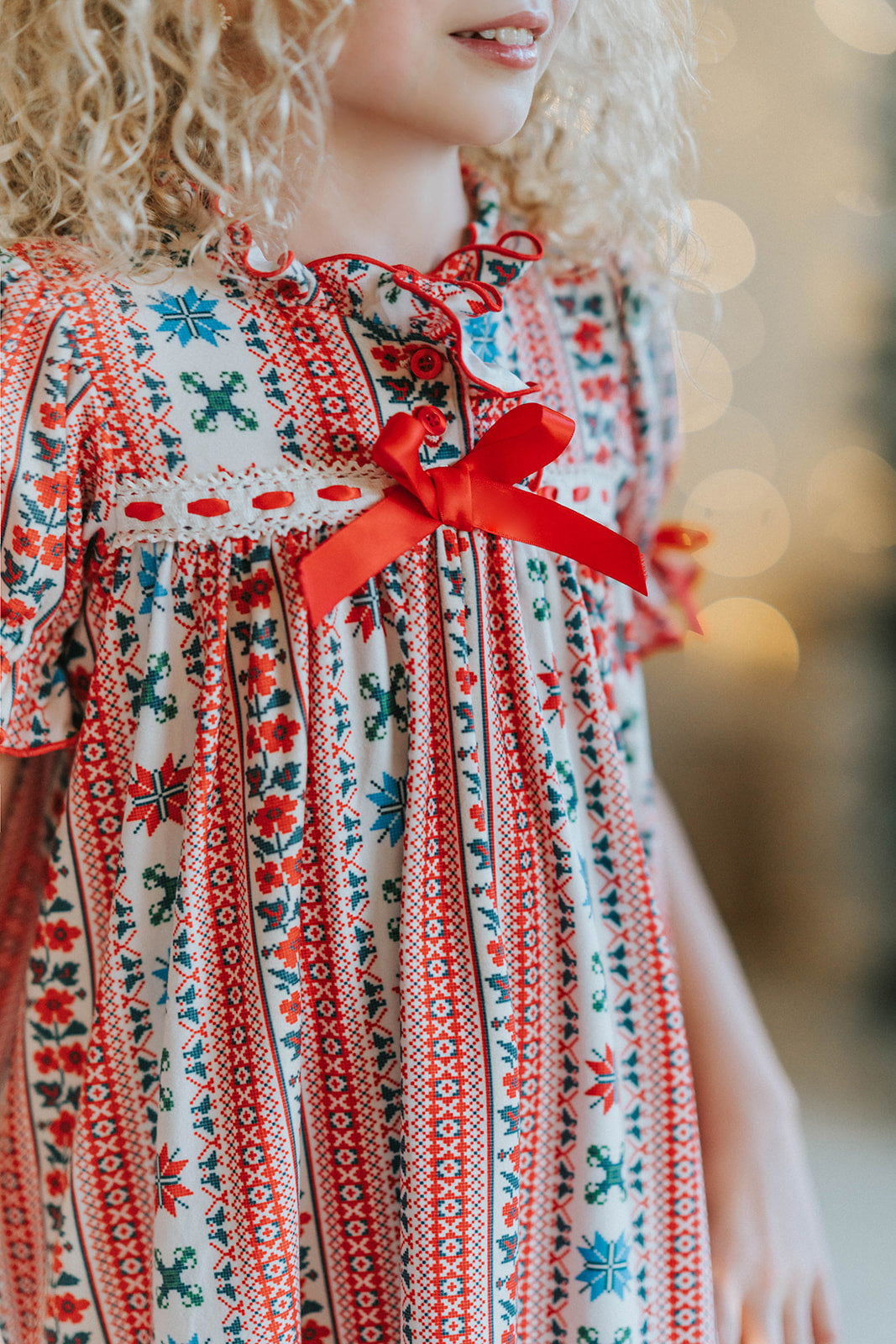 Vinterdal Scandinavian Christmas nightgown for girls with Nordic Fair Isle snowflake print, inspired by Frozen princess Anna and Elsa.

Frozen-inspired girls’ holiday nightgown featuring red and blue Nordic Fair Isle pattern, ruffled hem, and festive Christmas details.

Scandinavian princess nightgown with Fair Isle snowflake design, perfect Christmas sleepwear for Frozen fans and holiday photos.