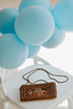 Brown beaded clutch purse with My Adventure Book cover design and multicolor lettering, styled with light blue balloons for an Up birthday party or travel-themed photoshoot.

Pixar Up–inspired beaded handbag with whimsical book cover styling, ideal for gifting to Disney lovers or little explorers heading to Disneyland or a balloon-themed party.

Adventurous crossbody bag for girls or women styled like the Up movie scrapbook, featuring intricate seed bead design and rope-style strap, photographed with pastel