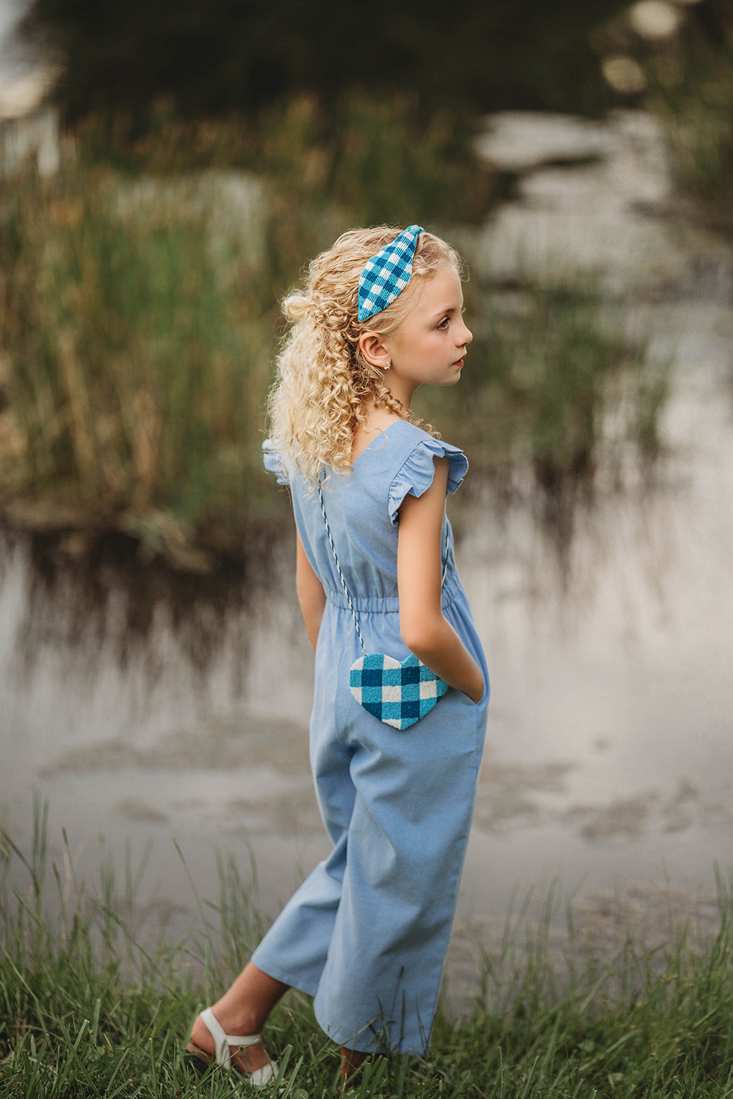 Girl wearing blue gingham beaded headband with ruffled blue romper, perfect for summer, dress-up, or cottagecore style

Close-up of child in buffalo check headband and blue outfit, ideal for spring photo shoots or vintage-inspired kids fashion

Blue and white plaid beaded headband on young girl with curly blonde hair, styled outdoors for summer dress-up or gifting

Toddler to tween wearing blue gingham headband, styled with coordinating romper and heart purse for picnic-ready outfit