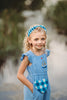Girl wearing blue gingham beaded headband with ruffled blue romper, perfect for summer, dress-up, or cottagecore style

Close-up of child in buffalo check headband and blue outfit, ideal for spring photo shoots or vintage-inspired kids fashion

Blue and white plaid beaded headband on young girl with curly blonde hair, styled outdoors for summer dress-up or gifting

Toddler to tween wearing blue gingham headband, styled with coordinating romper and heart purse for picnic-ready outfit