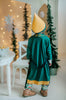 Child dressed in green Christmas pajamas with matching elf cone hat, standing in a winter-themed holiday setup

Boys festive holiday pajamas with playful Christmas print and felt elf hat, styled for family photos and Christmas morning

Toddler in Christmas sleepwear with reindeer and elf hat pattern, wearing slippers in cozy holiday backdrop with twinkle lights