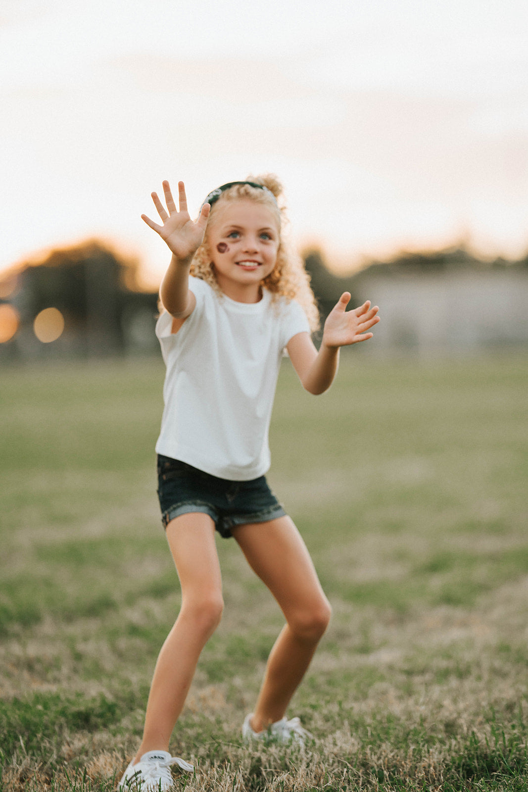 Girl wearing green “Go Spartans” headband holding a football on a grassy field at sunset, dressed in white tee and denim shorts

Child in team spirit outfit with green “Go Spartans” headband and football, perfect for game day or school pep rally

Little girl showing Spartan pride with beaded green headband and football, styled for fall sports or tailgate season

Girls football fan look with sparkly “Go Spartans” headband and casual outfit, standing in a field at golden hour