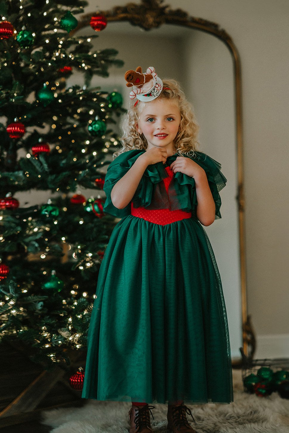 The Martha tulle cape is an excellent accessory for the Martha ballgown.  The evergreen ruffles of tulle tie at the neck with a satin ribbon.  