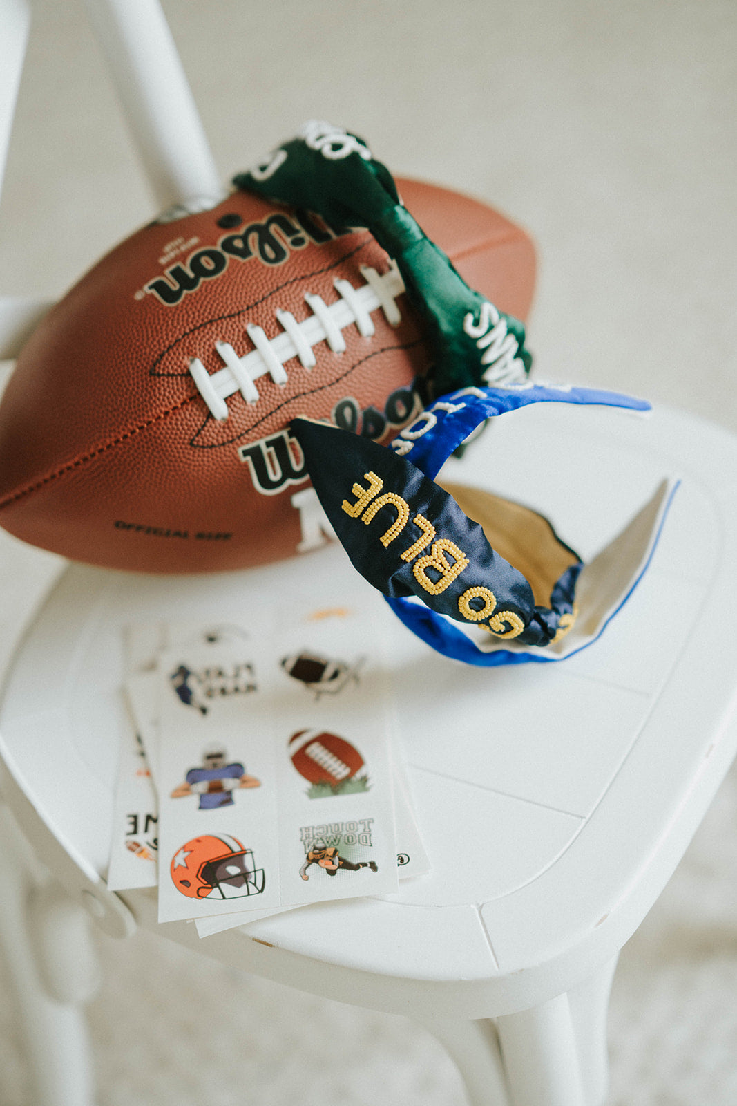 Girl wearing green “Go Spartans” headband holding a football on a grassy field at sunset, dressed in white tee and denim shorts

Child in team spirit outfit with green “Go Spartans” headband and football, perfect for game day or school pep rally

Little girl showing Spartan pride with beaded green headband and football, styled for fall sports or tailgate season

Girls football fan look with sparkly “Go Spartans” headband and casual outfit, standing in a field at golden hour