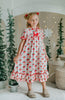 Vintage-style girls Christmas nightgown with red bows, holly print, ruffle trim, and satin bow, hanging on a carved white mirror

Classic holiday pajama dress for girls with red and green holly print, ruffle hem, and red satin bow at the neckline

Girls long sleeve Christmas nightgown with festive red bow and holly pattern, styled for holiday photos or heirloom gifting

Traditional girls holiday nightgown in white with red an