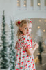 Classic holiday pajama dress for girls with red and green holly print, ruffle hem, and red satin bow at the neckline

Girls long sleeve Christmas nightgown with festive red bow and holly pattern, styled for holiday photos or heirloom gifting

Traditional girls holiday nightgown in white with red and green floral print, ruffle accents, and lace trim

Heirloom-inspired girls Christmas sleepwear with red bows and holly sprigs, perfect for festive morning photos or Christmas Eve