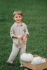 Boys beige button-up shirt with embroidered white pumpkin on chest pocket, hanging on vintage carved mirror for fall or Thanksgiving

Neutral boys fall shirt with embroidered pumpkin on pocket, styled for autumn photos, Thanksgiving, or sibling matching sets

Classic boys button-down shirt in light tan with embroidered blue pumpkin, perfect for harvest season or family portraits

Fall button-up shirt for toddlers and boys with embroidered pumpkin pocket detail, styled for Thanksgiving and heirloom outfits

