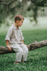 Boys beige button-up shirt with embroidered white pumpkin on chest pocket, hanging on vintage carved mirror for fall or Thanksgiving

Neutral boys fall shirt with embroidered pumpkin on pocket, styled for autumn photos, Thanksgiving, or sibling matching sets

Classic boys button-down shirt in light tan with embroidered blue pumpkin, perfect for harvest season or family portraits

Fall button-up shirt for toddlers and boys with embroidered pumpkin pocket detail, styled for Thanksgiving and heirloom outfits

