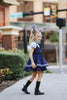 Girls Judy Hopps police costume dress inspired by Zootopia with blue puff sleeves, gold badge patch, and black tie detail

Zootopia-inspired girls dress with Judy Hopps police uniform design, featuring blue tones, tie, and badge for dress-up or Halloween

Toddler to tween Judy Hopps costume dress with pleated navy skirt, striped trim, and puff sleeve top styled like a bunny cop uniform