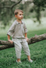 Boys beige button-up shirt with embroidered white pumpkin on chest pocket, hanging on vintage carved mirror for fall or Thanksgiving

Neutral boys fall shirt with embroidered pumpkin on pocket, styled for autumn photos, Thanksgiving, or sibling matching sets

Classic boys button-down shirt in light tan with embroidered blue pumpkin, perfect for harvest season or family portraits

Fall button-up shirt for toddlers and boys with embroidered pumpkin pocket detail, styled for Thanksgiving and heirloom outfits


