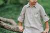 Boys beige button-up shirt with embroidered white pumpkin on chest pocket, hanging on vintage carved mirror for fall or Thanksgiving

Neutral boys fall shirt with embroidered pumpkin on pocket, styled for autumn photos, Thanksgiving, or sibling matching sets

Classic boys button-down shirt in light tan with embroidered blue pumpkin, perfect for harvest season or family portraits

Fall button-up shirt for toddlers and boys with embroidered pumpkin pocket detail, styled for Thanksgiving and heirloom outfits

