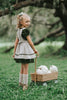 Girls green velvet dress with linen apron featuring embroidered pale blue pumpkin and ruffle trim, perfect for fall photos or Thanksgiving

Heirloom-style green velvet holiday dress with linen pinafore and pumpkin embroidery, styled for autumn or fairytale dress-up

Fall girls outfit with green velvet dress and embroidered pumpkin apron, hanging on vintage white carved mirror

Toddler to tween Thanksgiving dress with velvet base, apron pockets, and embroidered pumpkin design, ideal for family photos