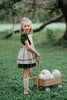Girls green velvet dress with linen apron featuring embroidered pale blue pumpkin and ruffle trim, perfect for fall photos or Thanksgiving

Heirloom-style green velvet holiday dress with linen pinafore and pumpkin embroidery, styled for autumn or fairytale dress-up

Fall girls outfit with green velvet dress and embroidered pumpkin apron, hanging on vintage white carved mirror

Toddler to tween Thanksgiving dress with velvet base, apron pockets, and embroidered pumpkin design, ideal for family photos