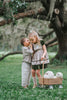Boys beige button-up shirt with embroidered white pumpkin on chest pocket, hanging on vintage carved mirror for fall or Thanksgiving

Neutral boys fall shirt with embroidered pumpkin on pocket, styled for autumn photos, Thanksgiving, or sibling matching sets

Classic boys button-down shirt in light tan with embroidered blue pumpkin, perfect for harvest season or family portraits

Fall button-up shirt for toddlers and boys with embroidered pumpkin pocket detail, styled for Thanksgiving and heirloom outfits

