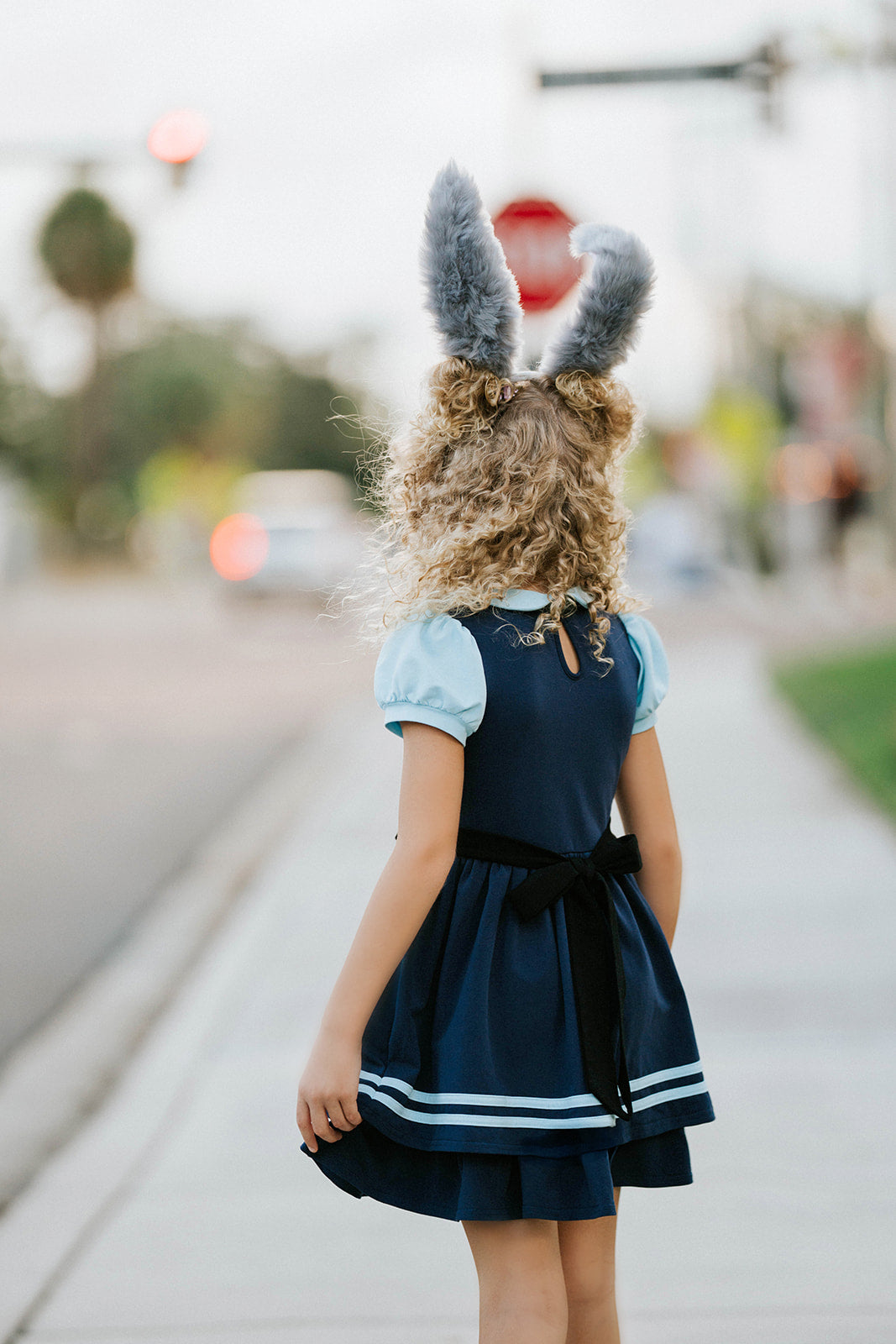 Toddler to tween Judy Hopps costume dress with pleated navy skirt, striped trim, and puff sleeve top styled like a bunny cop uniform

Girls Disneybound Judy Hopps dress with black tie, badge emblem, and blue colorblock police design, perfect for costumes and pretend play

Zootopia Judy Hopps cosplay dress for girls with puff sleeves, navy skirt, and gold badge on faux vest bodice
