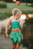 Young girl dressed in green two-piece leaf fairy costume, ideal for Halloween, themed birthdays, or magical dress-up play