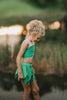 Young girl dressed in green two-piece leaf fairy costume, ideal for Halloween, themed birthdays, or magical dress-up play