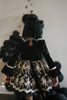 Elegant girls Halloween cat dress with hooded velvet top, gold lace trim, and full embroidered skirt, styled for spooky season

Gothic black and gold cat costume for girls with velvet hood, embroidered skirt, and satin bow, perfect for Halloween photoshoots

Child in hooded black cat dress with gold embroidery and velvet bodice, styled for Victorian Halloween or fairytale play

Girls velvet Halloween dress with cat ears, gold embroidered skirt, and ribbon bow, styled with tights and boots for a magical look