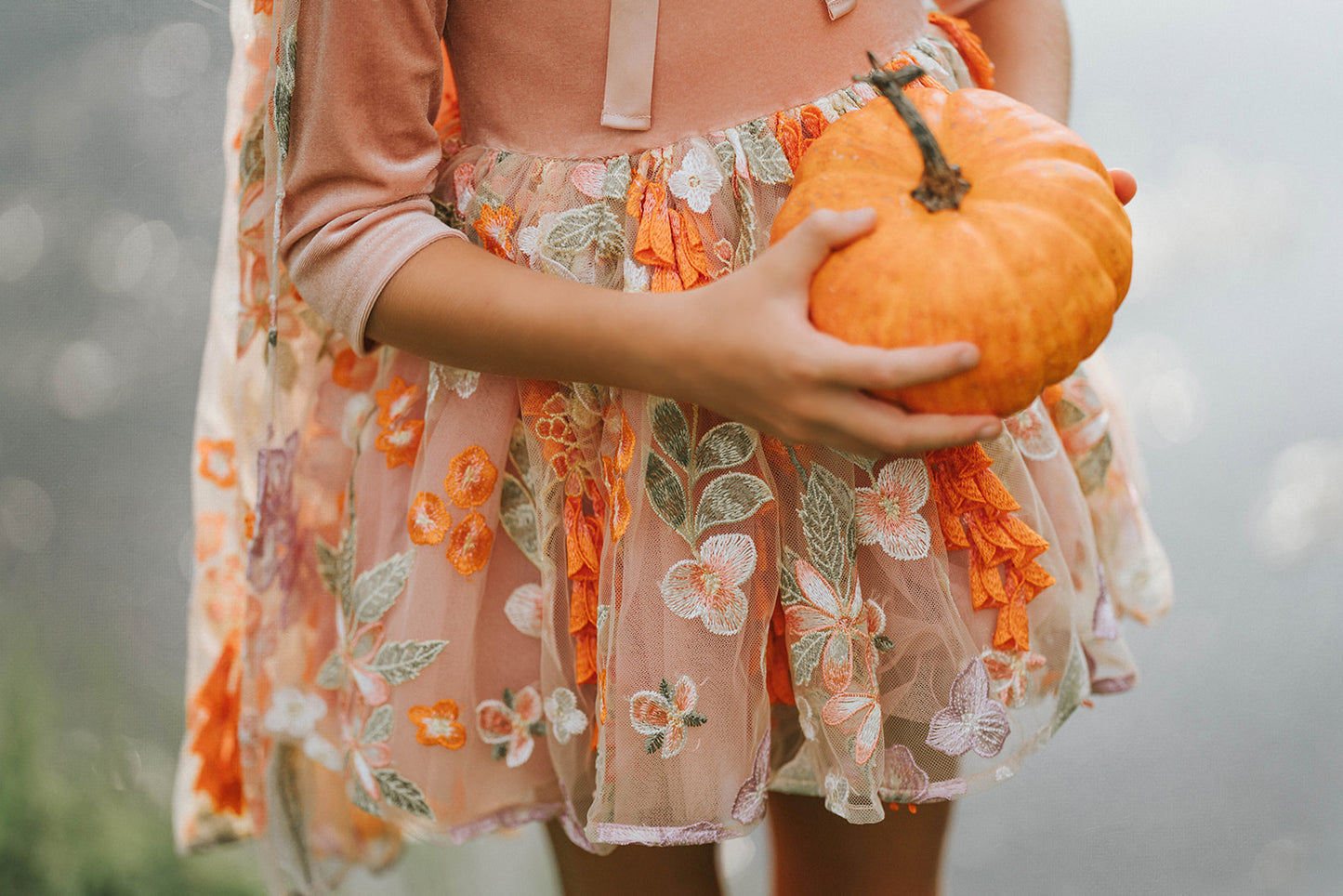 Boutique kids costume dress with matching floral cape and pumpkin tones – fairy-inspired twirl dress for fall celebrations