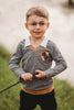 Toddler boy dressed in Gryffindor-inspired wizard shirt with crest and collar, holding wand and smiling outdoors

Young boy wearing wizard costume top with gold and red striped accents and crest patch, perfect for Halloween or dress-up

Wizard-themed boys shirt with collar and house crest, inspired by Harry Potter, styled for magical play or school events