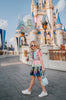 A vibrant metallic gown with colors of the rainbow. Pink flutter sleeves, tiered skirt perfect for twirling and a belted sash for that extra pizazz. 