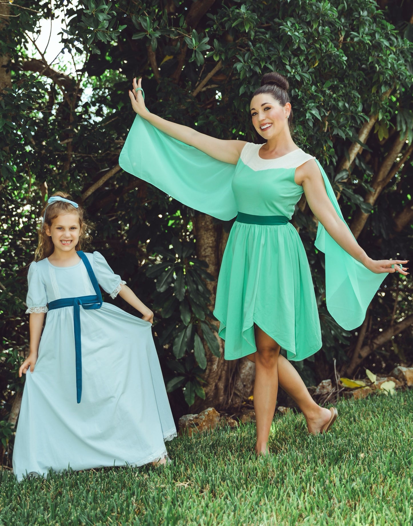 Green fairy cosplay dress for women featuring chiffon-style wings and fantasy-inspired silhouette, perfect for Tinkerbell look

Tinkerbell-inspired adult dress with wing sleeves and high-low hem, worn by smiling woman outdoors surrounded by trees

Fantasy cosplay dress for women in light green with fairy wing-style sleeves and fitted waist, ideal for costume or fairytale shoot