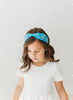 A bright blue satin headband with snowflake crystal beadwork.  Designed for all day comfort. 