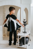 A young boy wears a solid black t-shirt. There are removable bat wings fastened to the back.  They have metallic silver around the top and coming down to the bottom in long lines. There is elastic on the wings to put arms in to so the wings can be held out in a cape style motion. Perfect for spooky season.