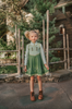 For the first time in forever....a short sleeve cotton twirl dress in spring greens.  The bodice is adorned with 6 buttons and iridescent ribbon. There is a faux vest look and the skirt is a bright earthy green with floral pattern on the hem. Perfect for getting out of the castle. 