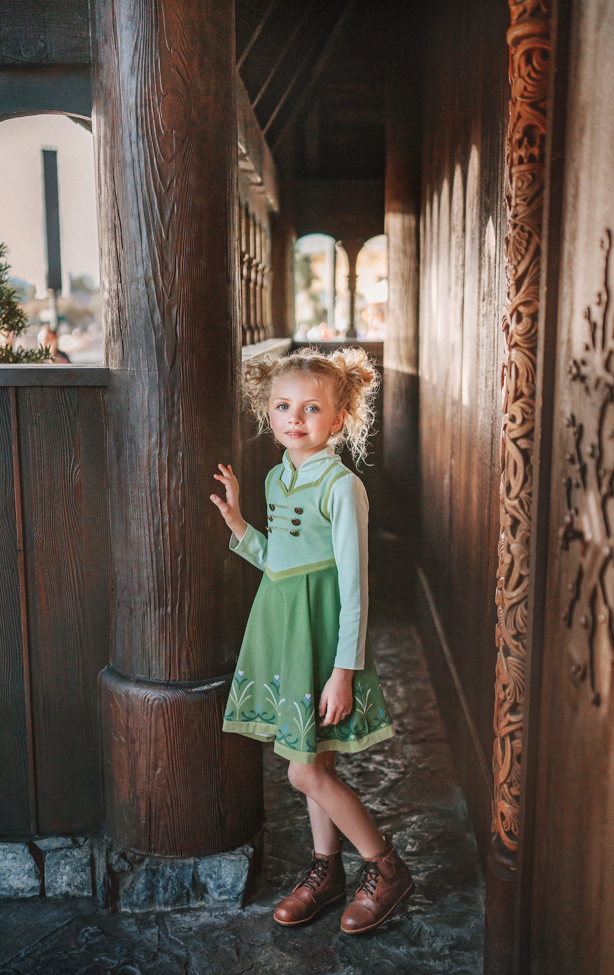 For the first time in forever....a long sleeve cotton twirl dress in spring greens.  The bodice is adorned with 6 buttons and iridescent ribbon. There is a faux vest look and the skirt is a bright earthy green with floral pattern on the hem. Perfect for getting out of the castle. 