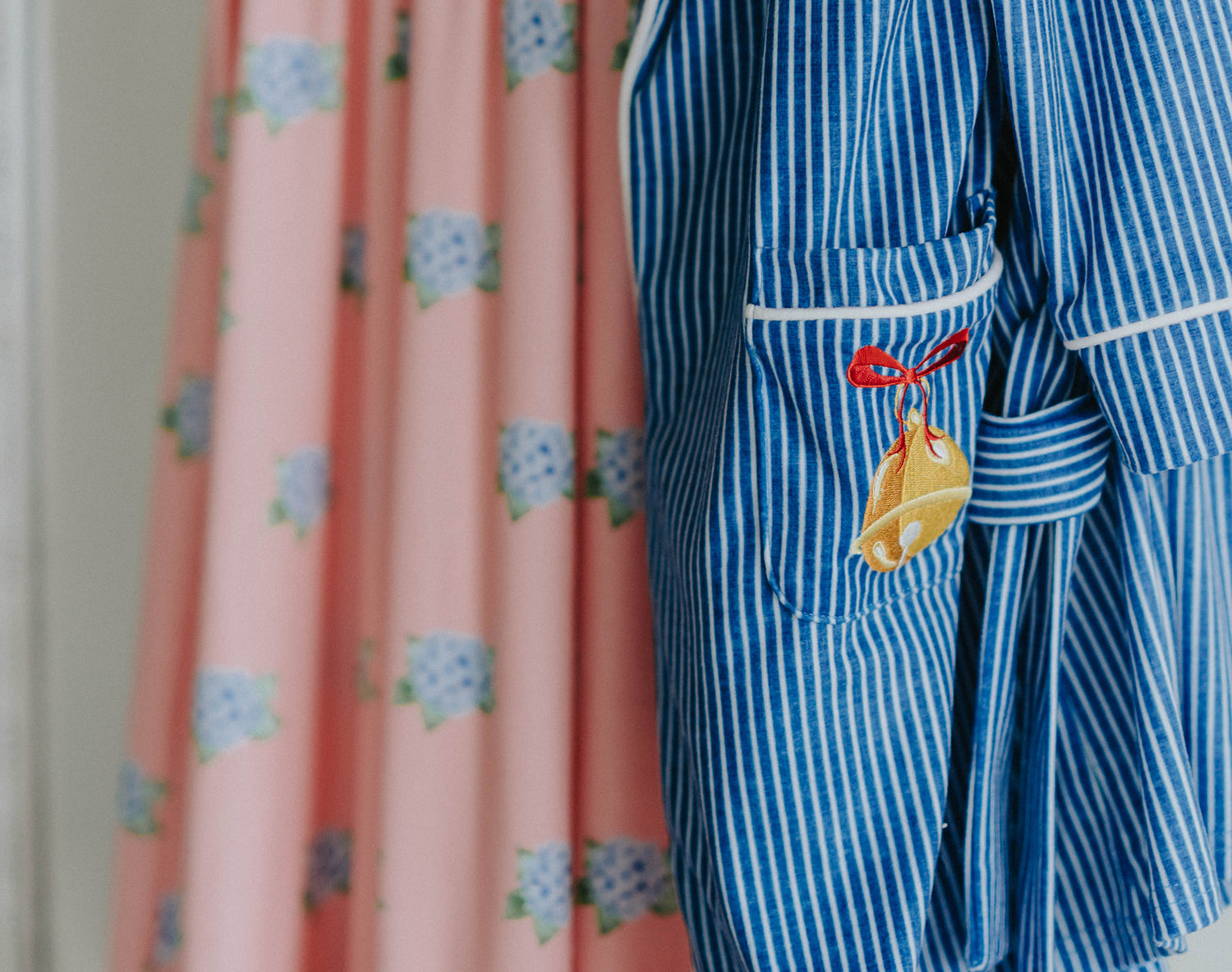 Close-up of child wearing blue striped Polar Express robe with gold bell embroidery on pocket and cozy Christmas pajamas underneath

Kids holiday robe inspired by Polar Express with white piping, gold bell patch, and tie waist, styled for Christmas morning

Blue and white striped Christmas robe with gold bell detail, worn by child with cozy holiday pajamas and slippers

Polar Express-themed unisex robe with gold bell embroidery and piping trim, perfect for kids’ Christmas sleepwear