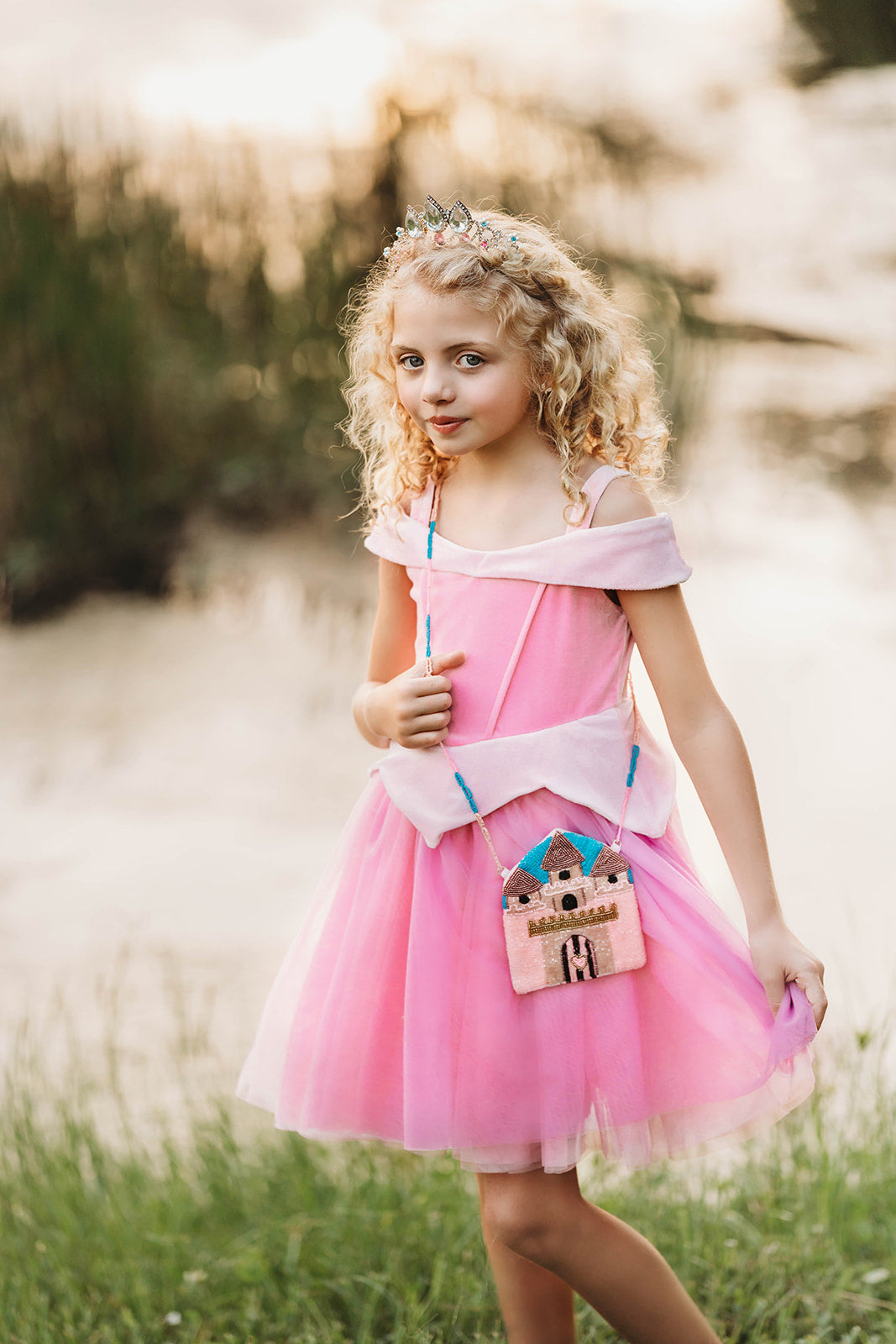Fairytale castle crossbody purse for girls with beaded details, styled with pink velvet and tulle dress for magical playtime